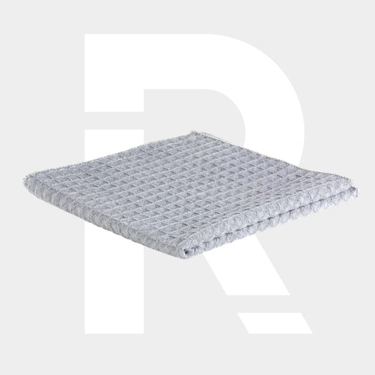 A folded light gray Glass Towel with a waffle texture is shown on a plain background, featuring a large, faint white "R"—a premium microvezeldoek glas ideal for streak-free cleaning results.