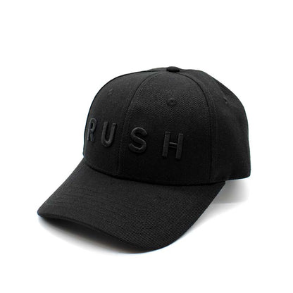 The RUSH Baseball Cap is a black adjustable cap with "RUSH" in raised black letters on the front, pictured on a white background. Perfect for anyone who lives life in the fast lane.